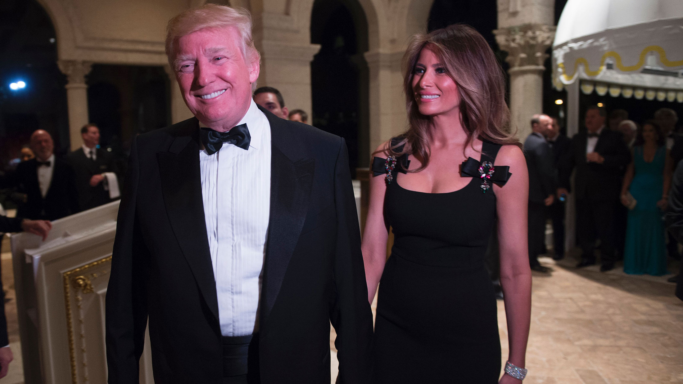 President-elect Donald Trump arrives with his wife, Melania, for a New Year's Eve party on Dec. 31, 2016, at Mar-a-Lago in Palm Beach, Florida.
