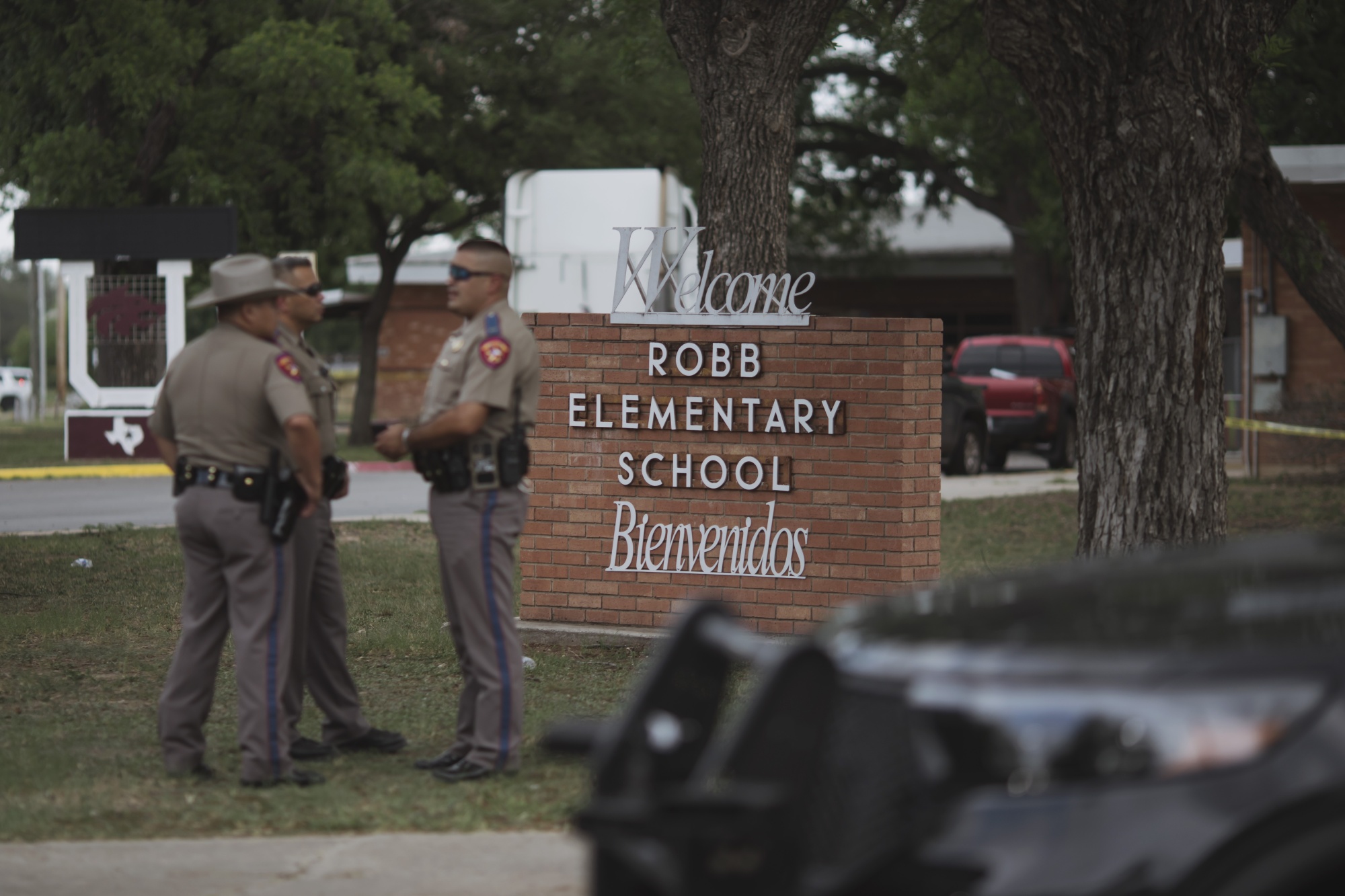 Texas state troopers stand guard following a shooting at Robb Elementary School&nbsp;in Uvalde, Texas, on May 24.