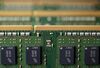 Micron Technology Inc. Double-Data-Rate Synchronous Random-Access Memory (SDRAM) chips are arranged for a photograph in Tokyo, Japan, on Wednesday, July 15, 2015. The investment arm of one of China's top universities is planning to offer $23 billion for chipmaker Micron Technology, a person familiar with the matter said, a deal that would be the largest takeover of a foreign firm by a Chinese company.