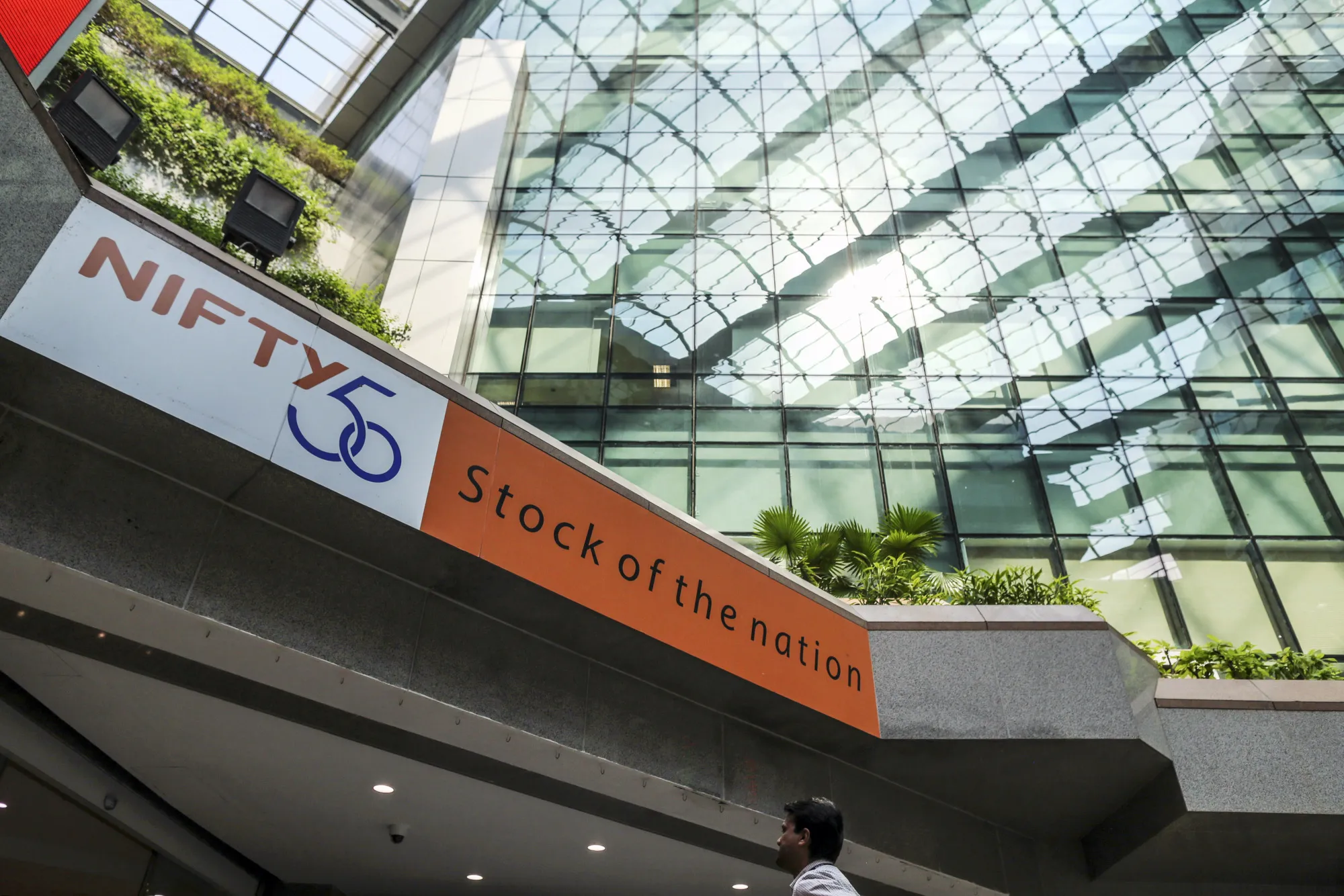 Signage for the Nifty 50 Index is displayed in the atrium of the National Stock Exchange of India building in Mumbai.