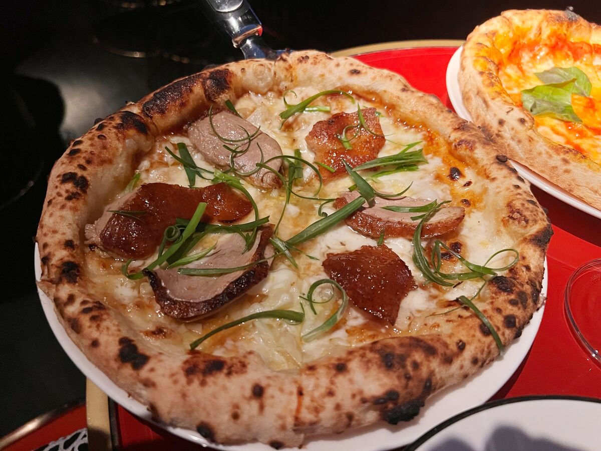 bloomberg.com - Julia Fioretti - Peking Duck Pizza Is Hong Kong's Food Fusion Trend Gone Too Far