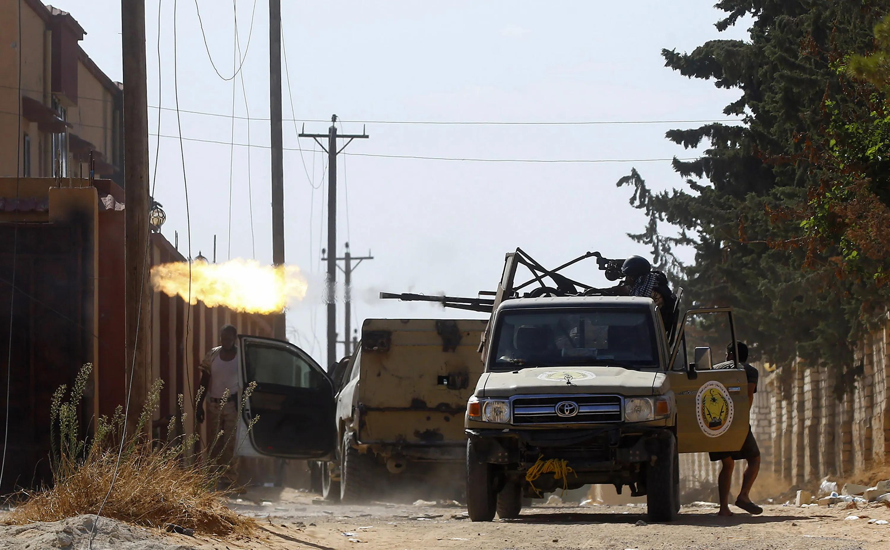 A fighter loyal to the internationally recognised Libyan Government of National Accord fires a truck-mounted gun during clashes with forces loyal to&nbsp;Khalifa Haftar in Tripoli on Sept. 7.