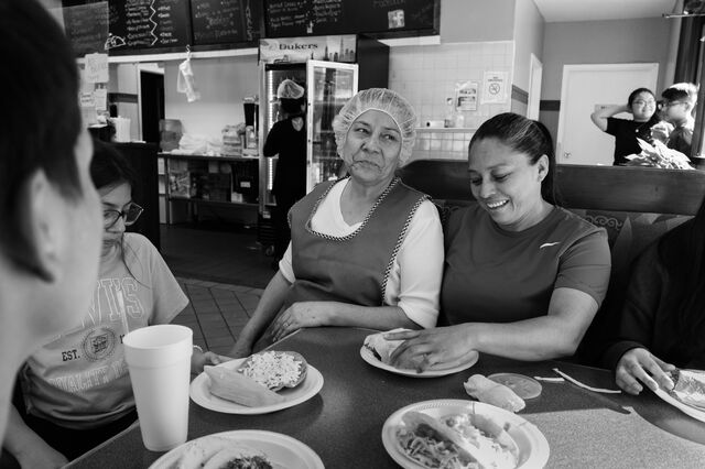 Nunez sits with her mother-in-law, Lupe Nunez, and family at Lupe's restaurant.