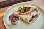 A Dishoom &quot;Vegan Sausage Naan Roll&quot;, using a sausage developed with Chef Neil Rankin.