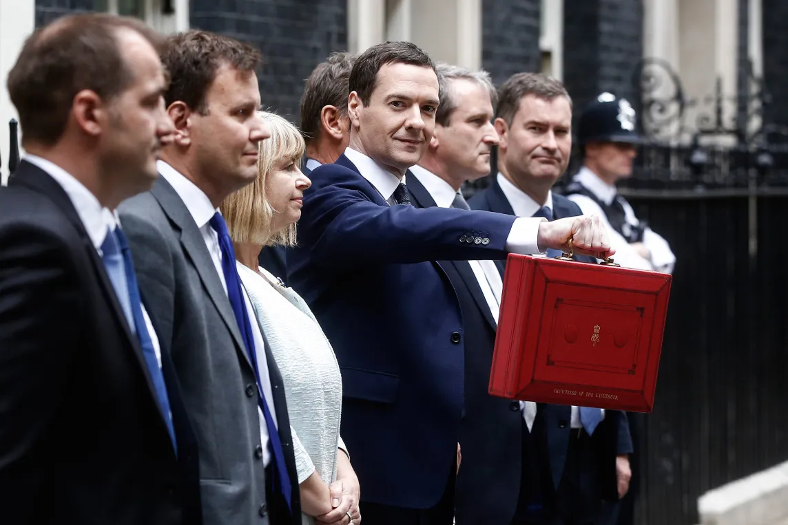 George Osborne, U.K. chancellor of the exchequer, holds the dispatch box containing the first budget by a Tory-majority government in almost two decades, as he exits 11 Downing Street in London on July 8, 2015.
