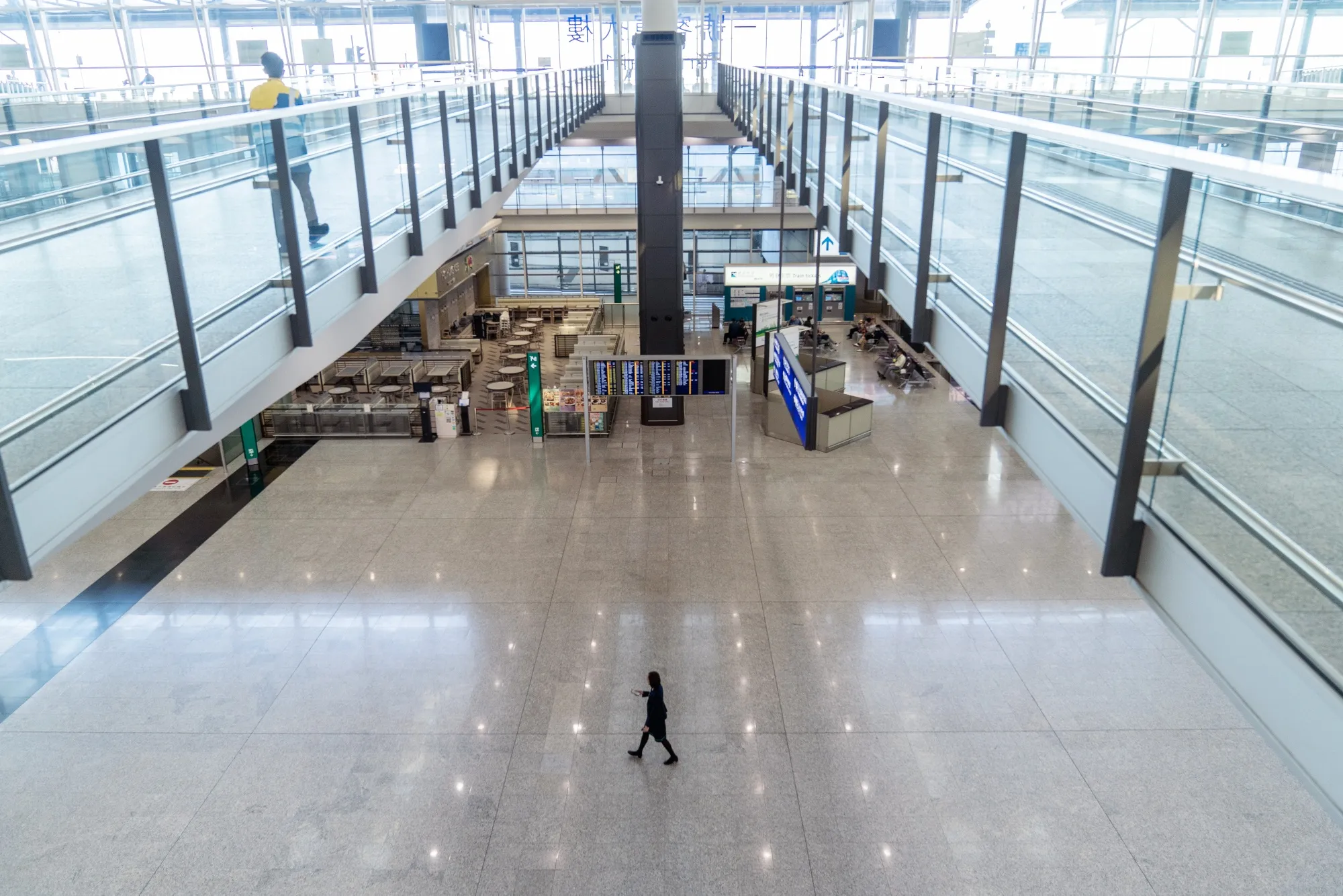 A staff member walks through the arrivals hall at Hong Kong International Airport on Nov. 29.