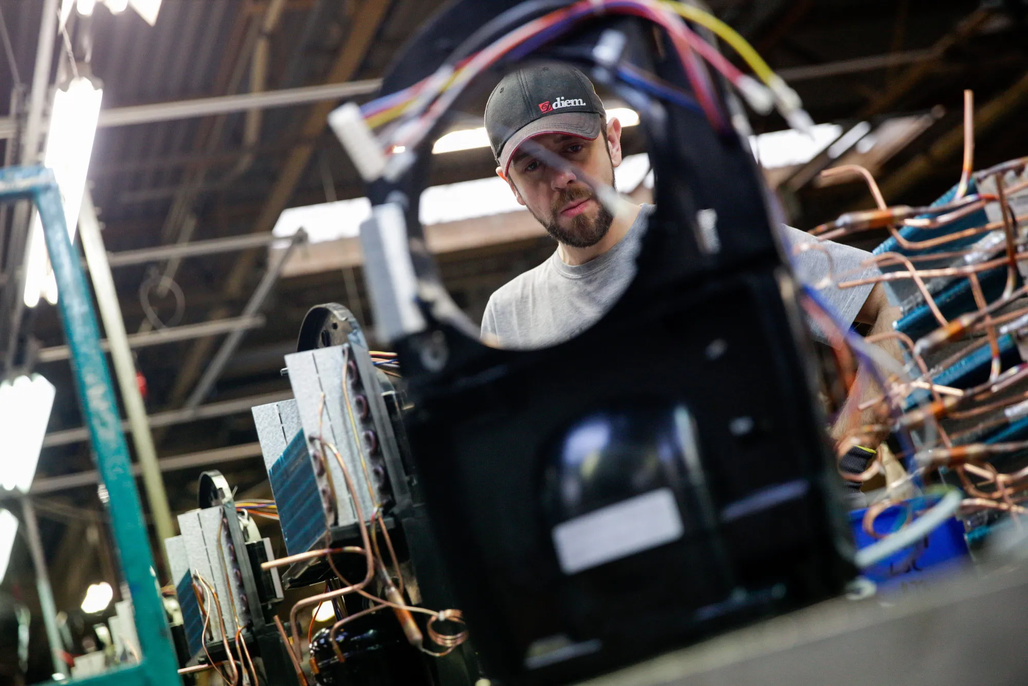 An employee assembles a dehumidifier on a production line in Newton Aycliffe, U.K.&nbsp;