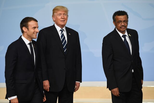 French President Emmanuel Macron, US President Donald Trump and WHO Director-General Tedros Ghebreyesus at the G20 summit in Hamburg, northern Germany, in July 2017. 