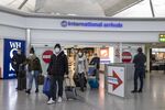 Airline Travelers as U.K. Scraps Pre-Departure Covid Tests for Vaccinated Visitors