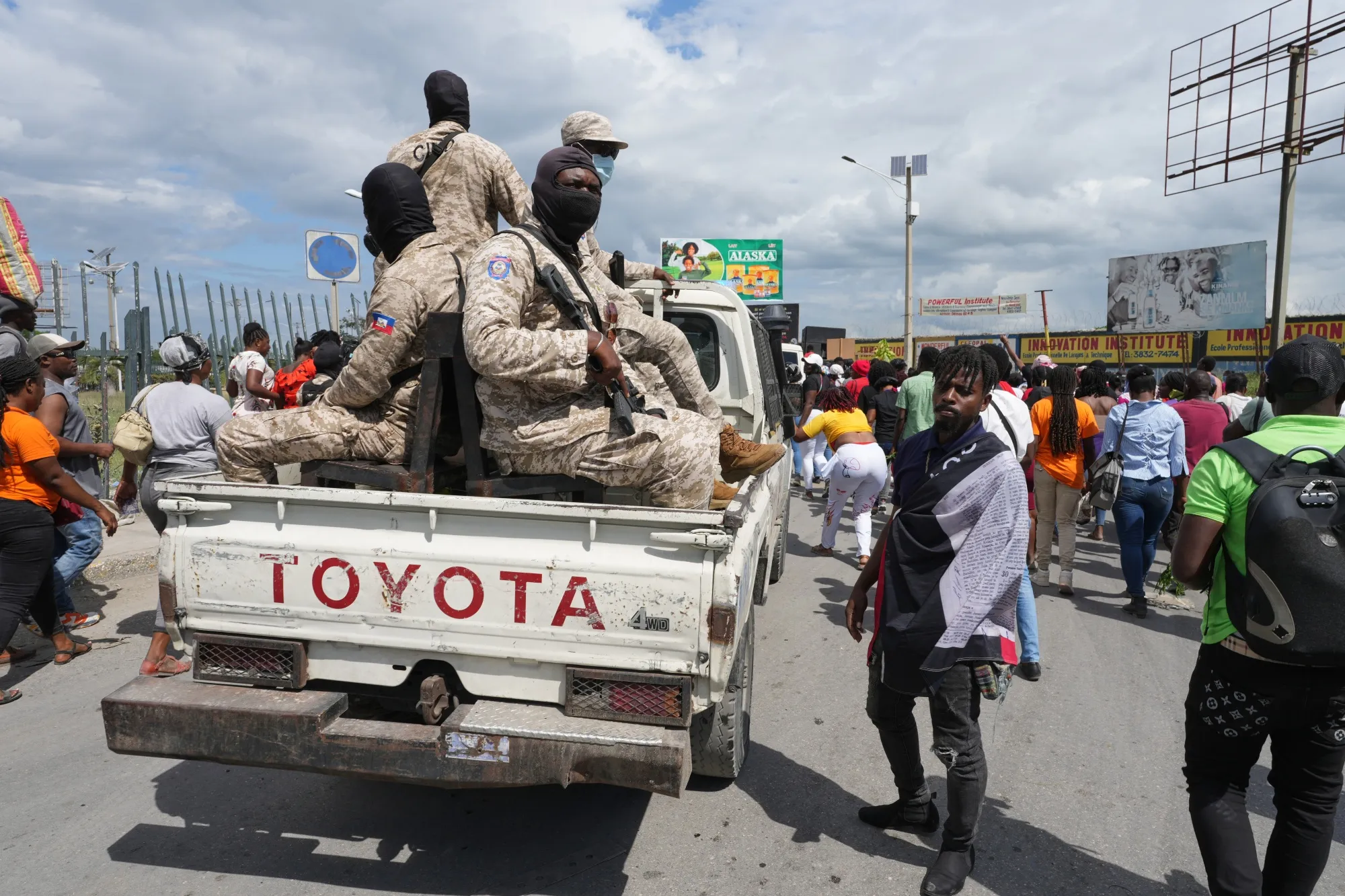 National Police patrol along a road in Port-au-Prince, Haiti on April 13.