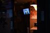 A television screen displays a news conference held by Haruhiko Kuroda, governor of the Bank of Japan.