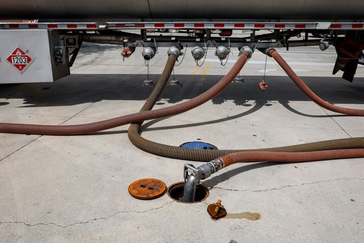 A fuel tanker delivers fuel to a gas station in the US. 