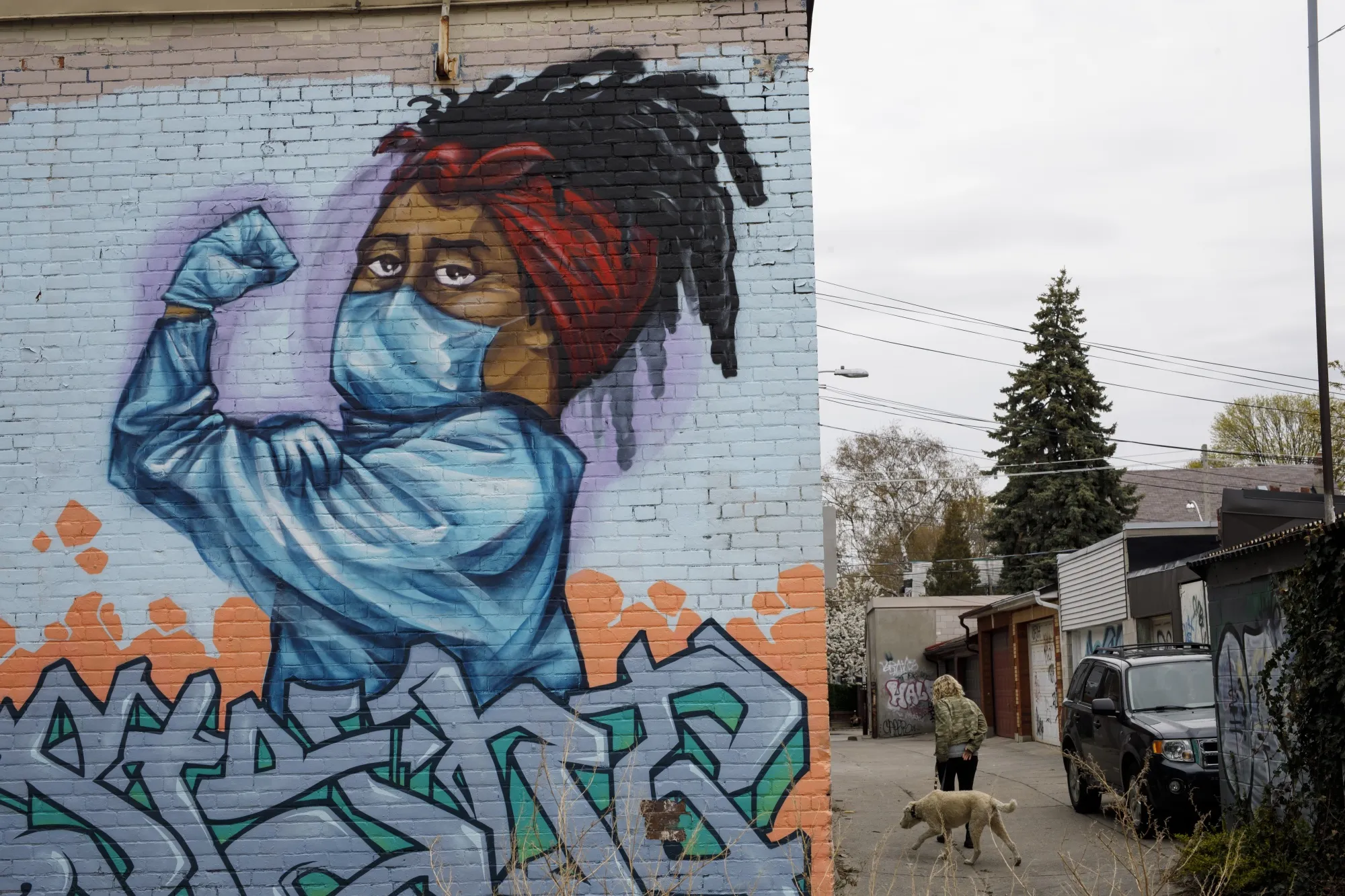 A mural dedicated to healthcare workers in Toronto, where the benchmark S&amp;P/TSX composite index is up 14% this year.