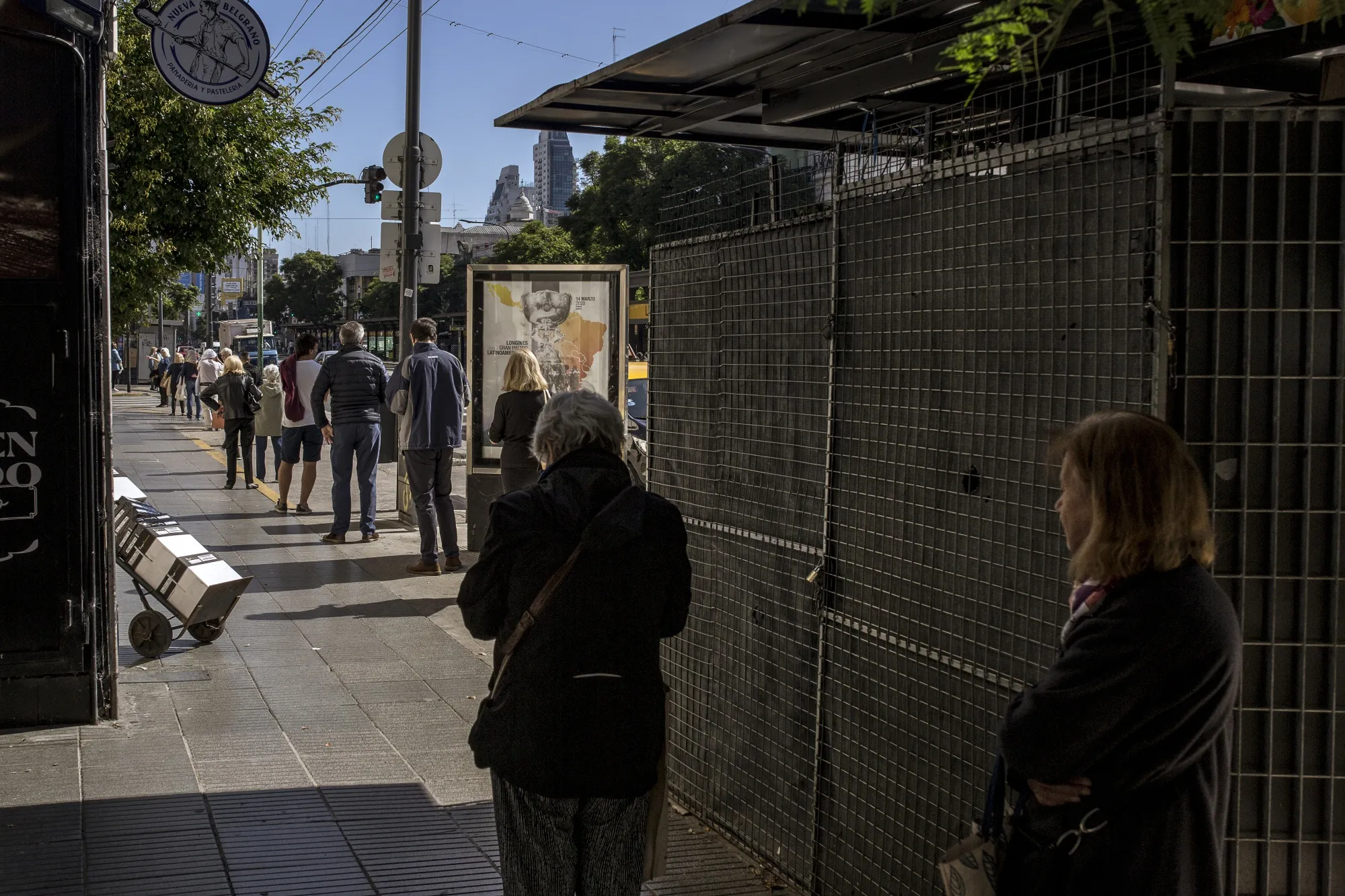 People line up a block away from Banco de la Nacion in Buenos Aires, Argentina, on April 3.&nbsp;