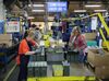 Employees inspect ammunition prior to distribution at Lake City Army Ammunition Plant.