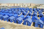 Temporary housing is constructed for flood victims in Hyderabad, Pakistan, Tuesday, Sept. 6, 2022. In flood-stricken Pakistan where an unprecedented monsoon season has already killed hundreds of people, the rains are now threatening an ancient archeological site dating back 4,500 years, the site's chief official said Tuesday. (AP Photo/Pervez Masih)