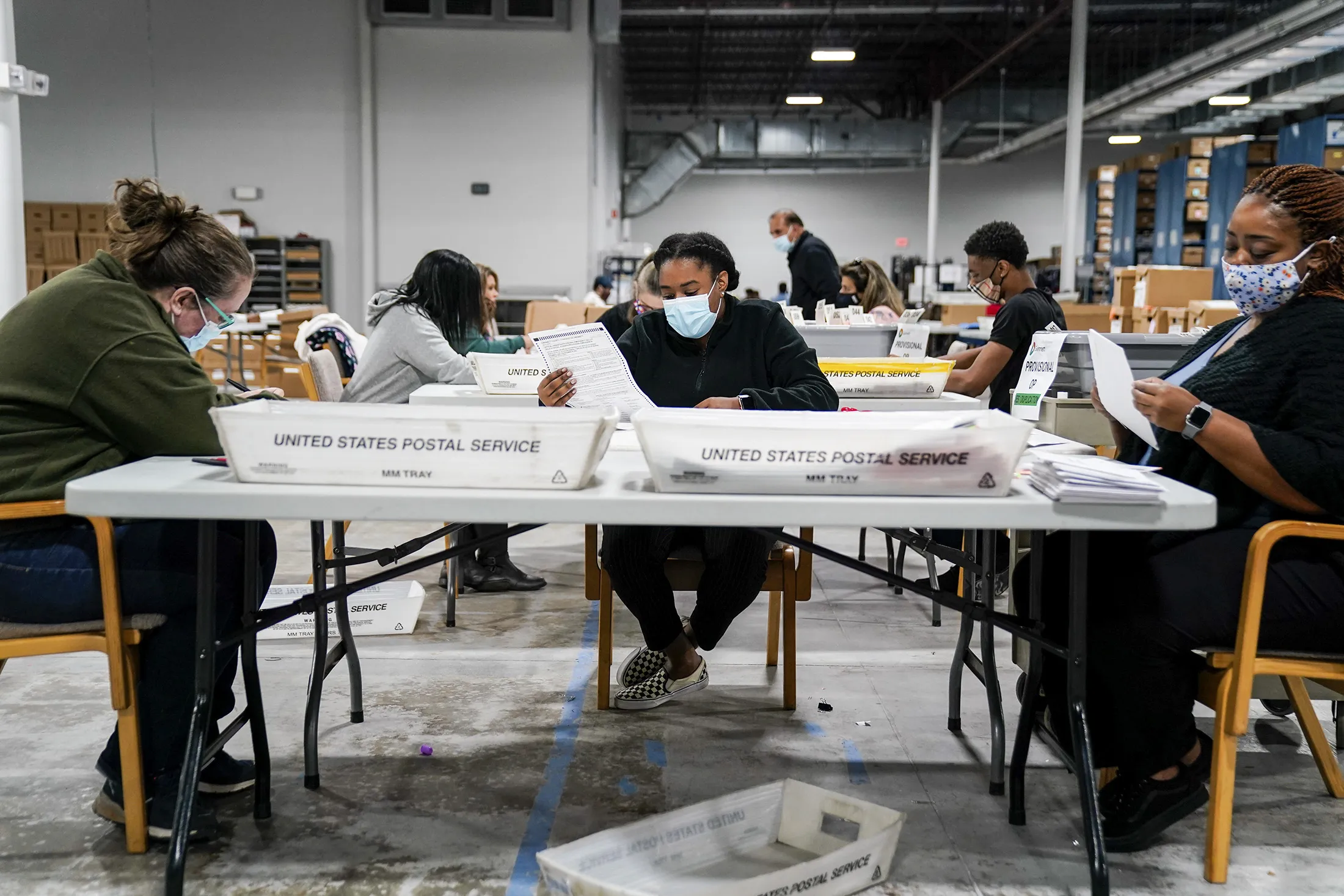 Election workers validate ballots at the Gwinnett County&nbsp;Elections Office on&nbsp;Nov. 6, 2020.