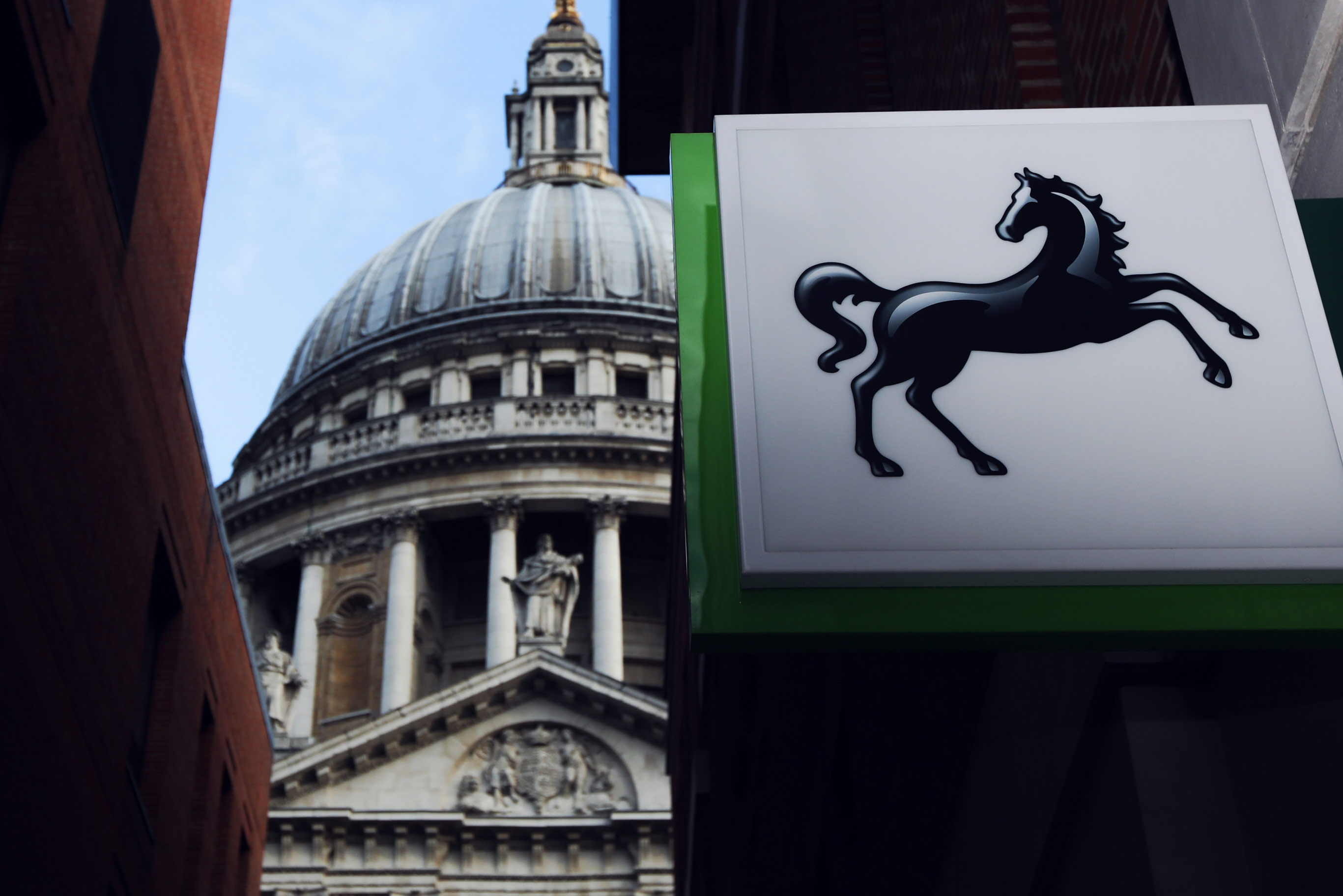 A sign hangs above a Lloyds bank branch, a unit of Lloyds Banking Group Plc, near St Paul's Cathedral, in London.