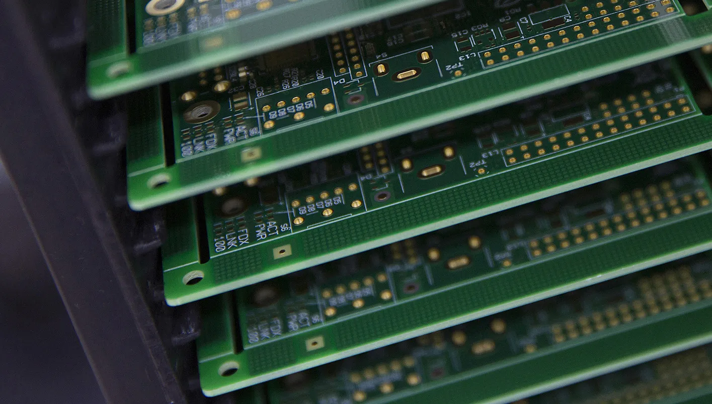 Printed circuit boards for Raspberry Pi single-board computers sit stacked ahead of assembly on the production line at Sony Corp.'s technology centre in Pencoed, U.K., on Monday Dec. 16, 2013. Raspberry Pi, a low-cost computer designed primarily for children, was developed in the computer laboratory of the University of Cambridge.