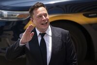 Elon Musk, chief executive officer of Tesla Inc., waves while departing court during the SolarCity trial in Wilmington, Delaware, U.S., on Tuesday, July 13, 2021.