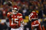 Kansas City Chiefs quarterback Patrick Mahomes (15) throws a 4-yard touchdown pass to running back Jerick McKinnon, right, during the first half of an NFL wild-card playoff football game, Sunday, Jan. 16, 2022, in Kansas City, Mo. (AP Photo/Colin E. Braley)