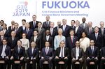 Group of 20 (G-20) finance ministers and central bank governors pose for a family photo at the end of meetings, June 9.