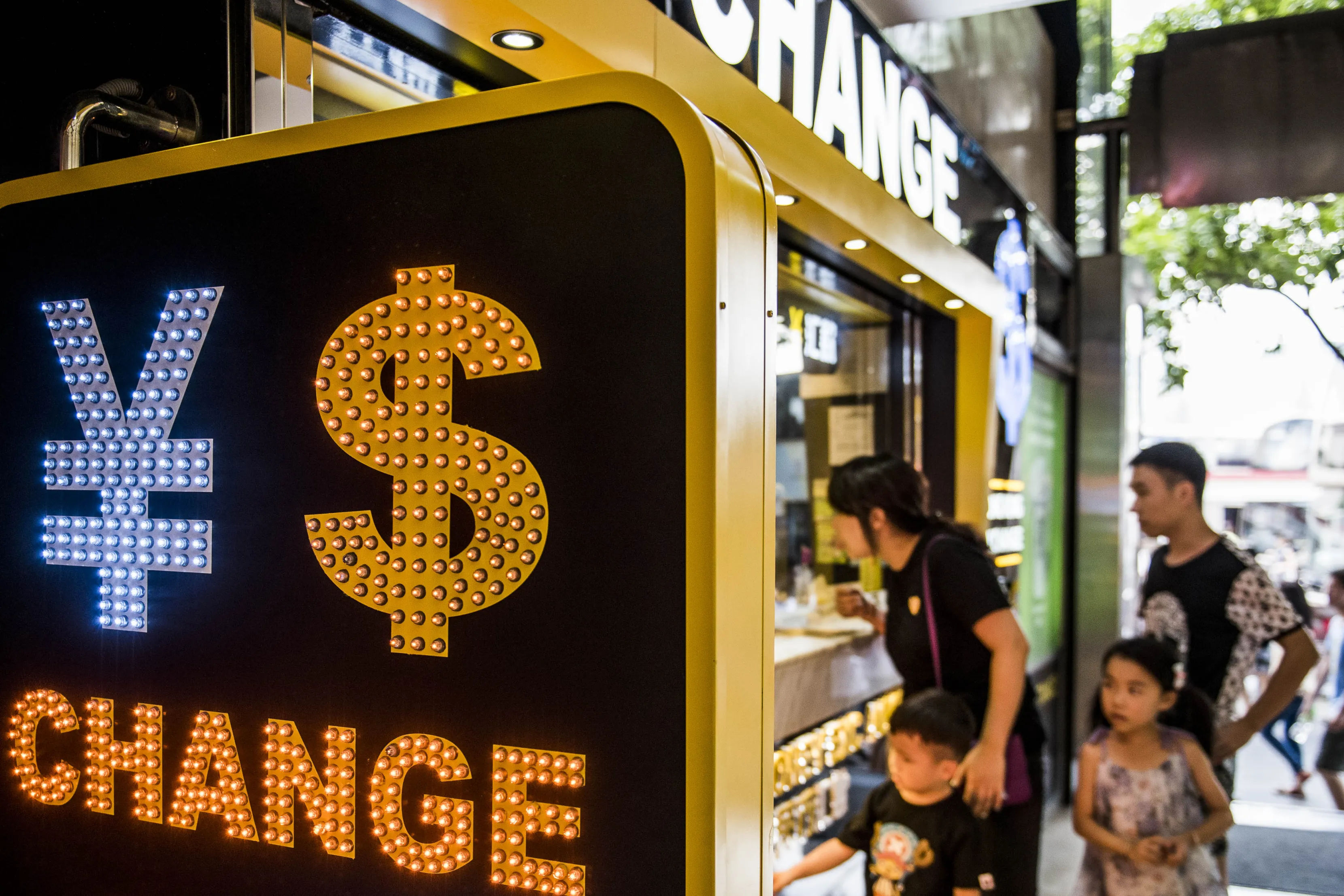 The symbols for the Chinese yuan and the dollar is displayed at a currency exchange store in Hong Kong.&nbsp;