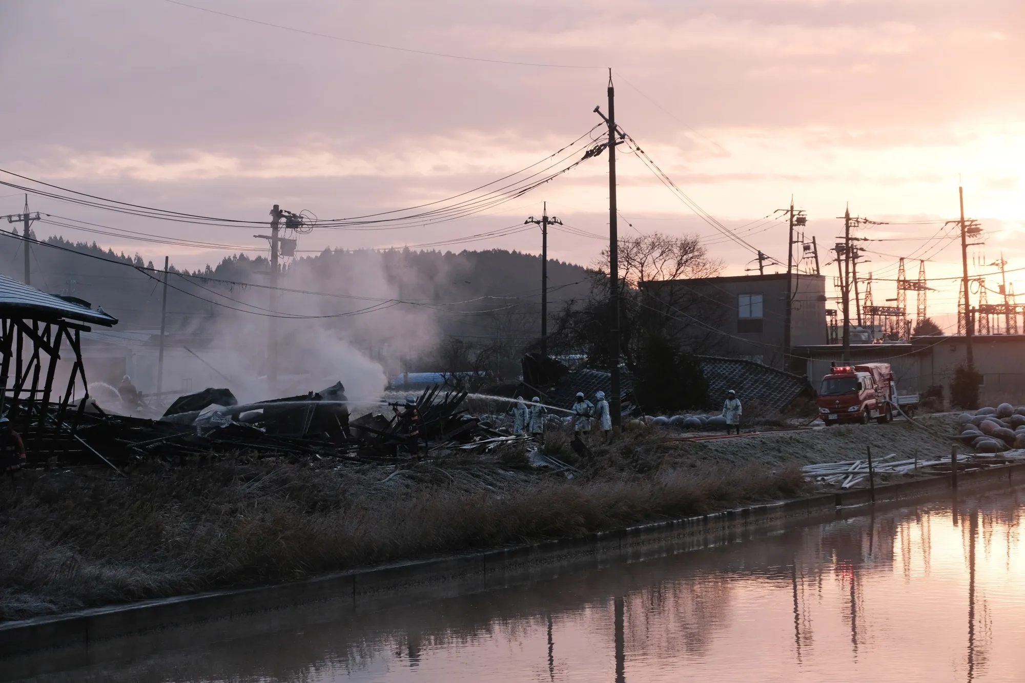 Firefighters extinguish a fire in Nanao, Ishikawa Prefecture, on Jan. 2.