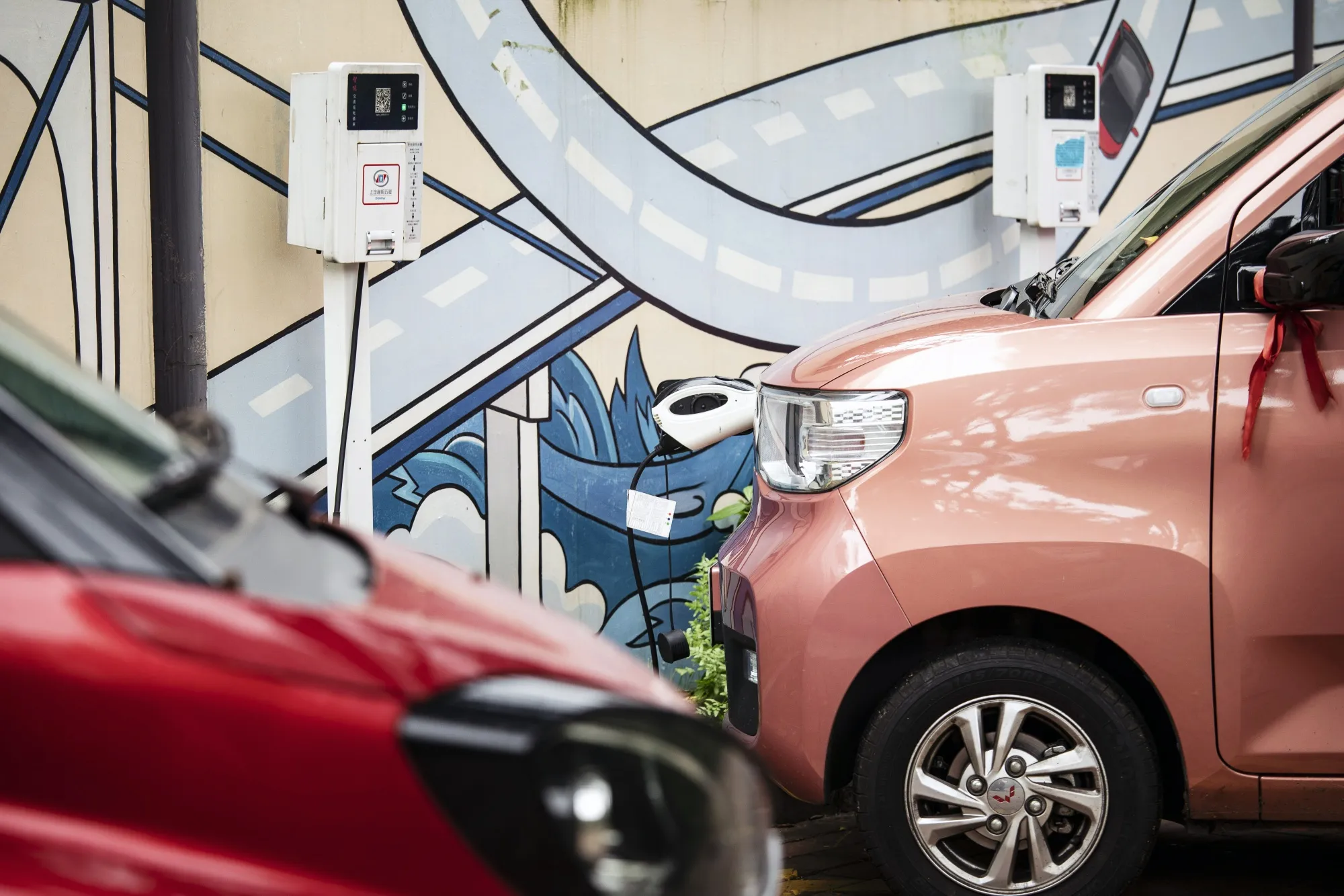 Electric vehicles next to charging stations in Liuzhou, China.&nbsp;
