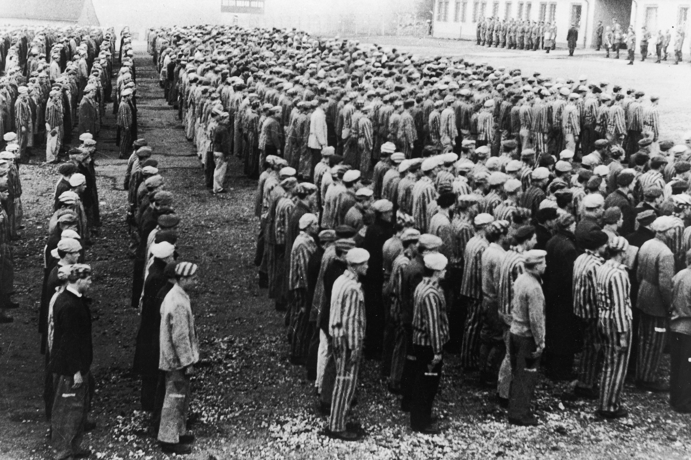 Prisoners stand before Nazi officers at the Buchenwald Concentration Camp,&nbsp; in Weimar, Germany, World War II, circa 1943.&nbsp;