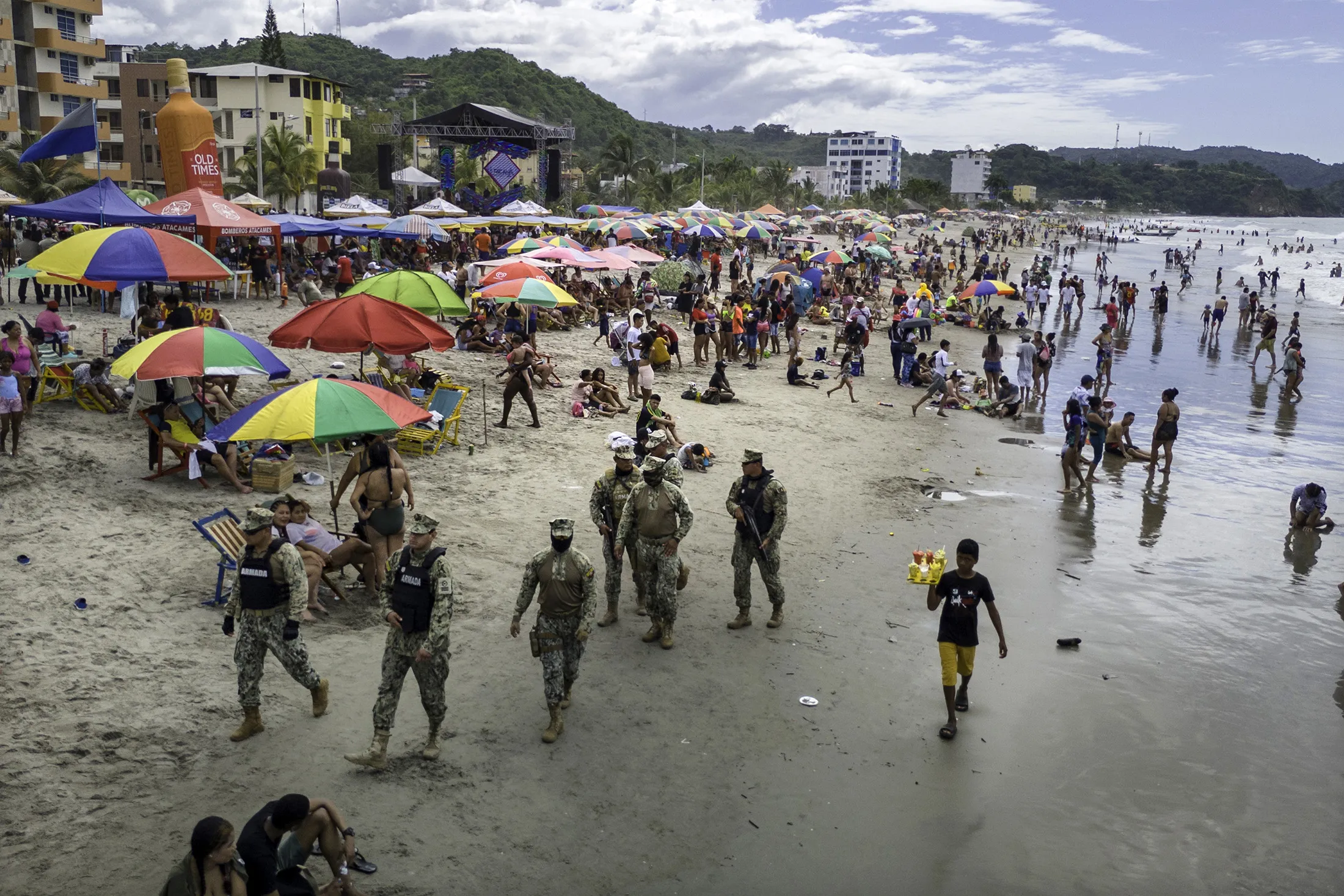 Soldiers patrol a beach in Atacames, Ecuador during Carnival weekend in February. Concerns about violence have been a challenge for the nation’s travel industry.