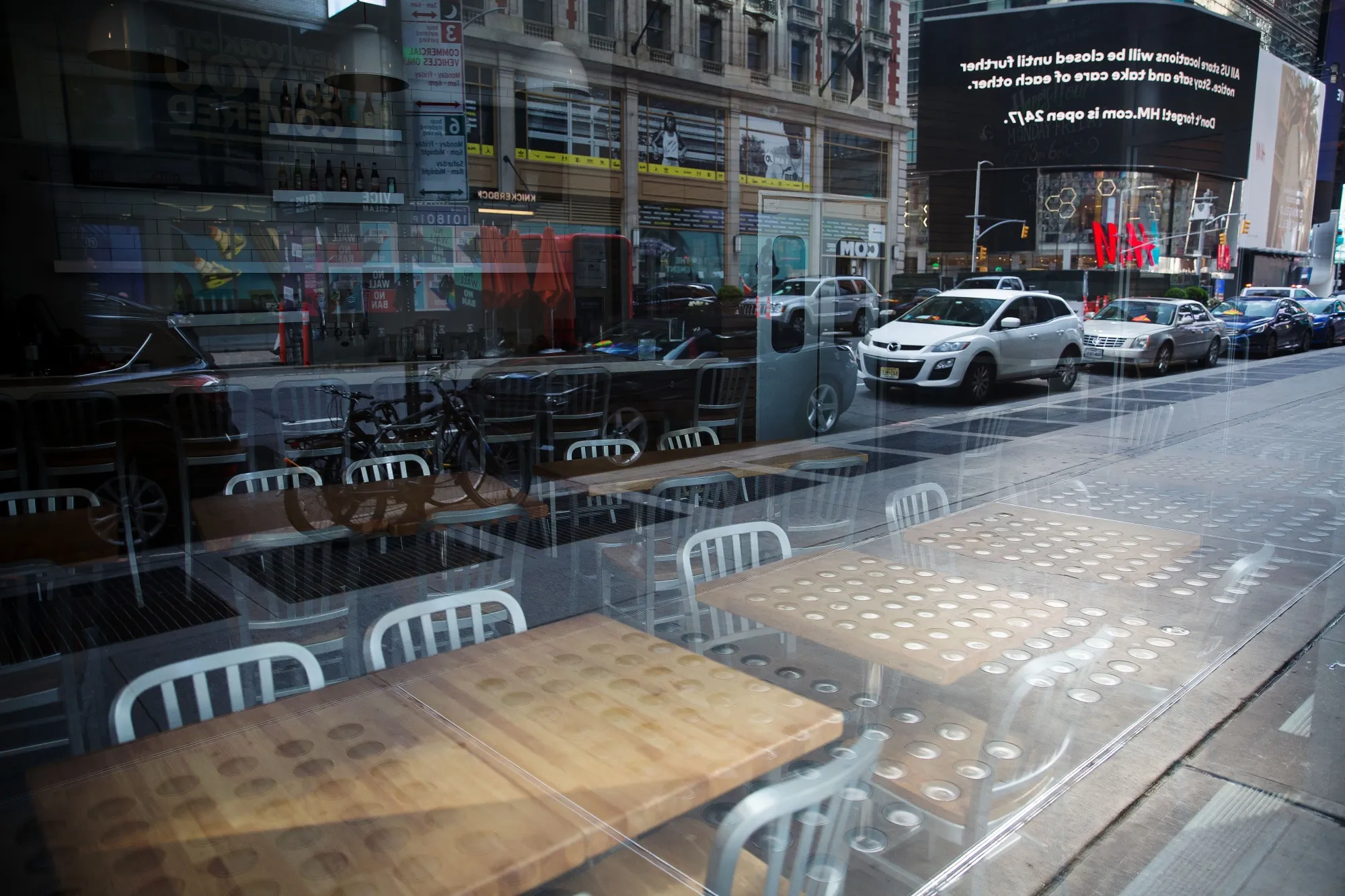 Chairs and tables sit inside a closed restaurant in Times Square in New York, U.S., on&nbsp;April 21.