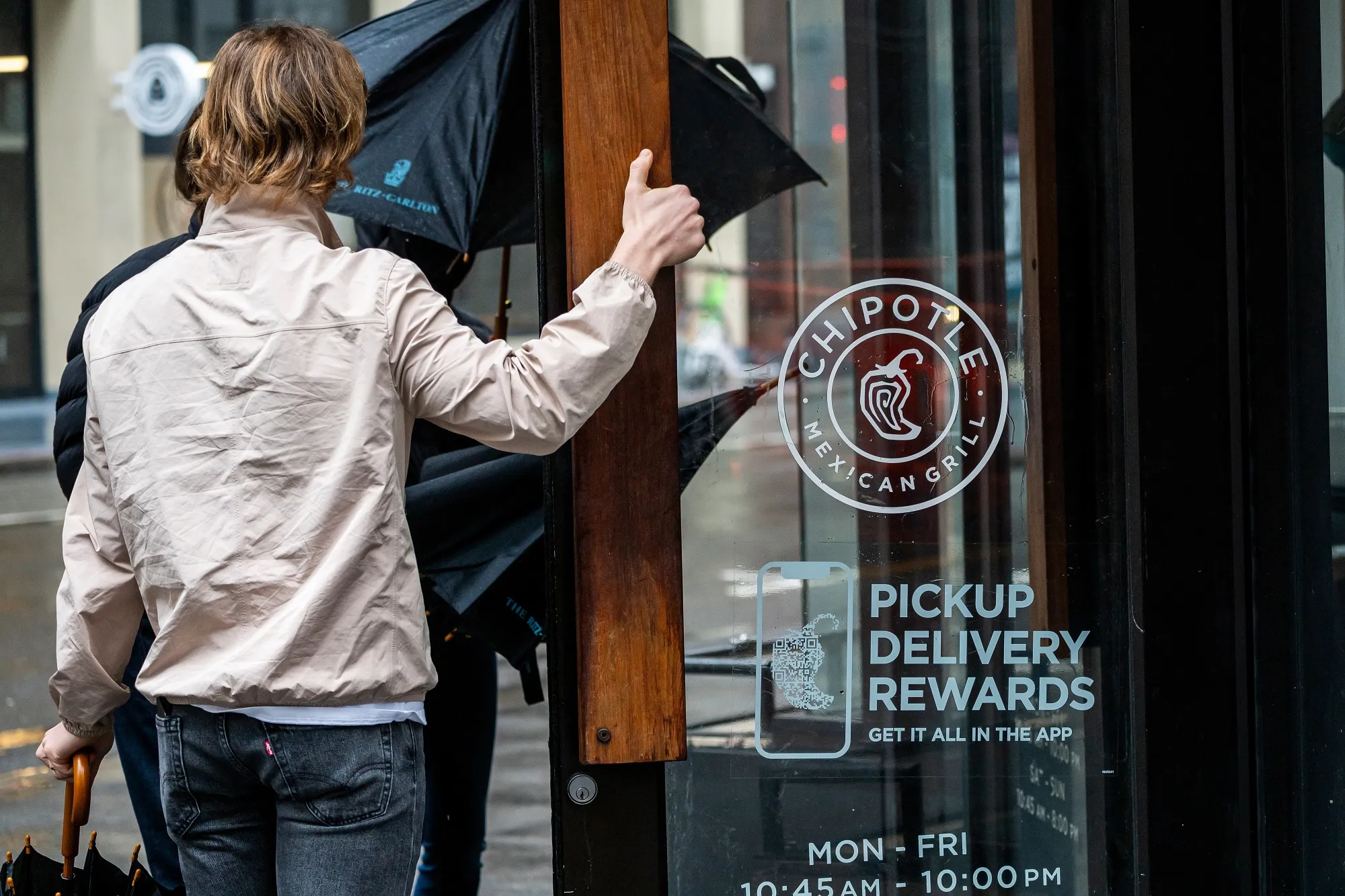 Customers enter a Chipotle restaurant in San Francisco.