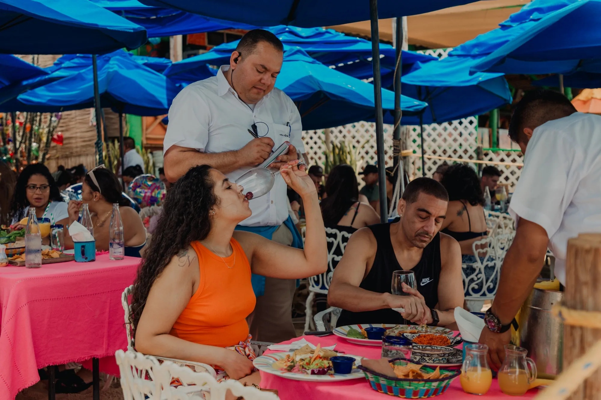 Tourists dine at a restaurant in Cabo San Lucas, Baja California Sur state, Mexico, on June 24. The services sector remains strong in Mexico, creating jobs&nbsp;even as the central bank keeps borrowing costs at 11.25%, a record high.