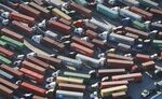 Trucks stand prepared to haul shipping containers at the Port of Los Angeles.