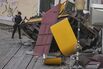 A police officer inspects the site of the derailed Elevador da Gloria in Lisbon, on Sept. 4.