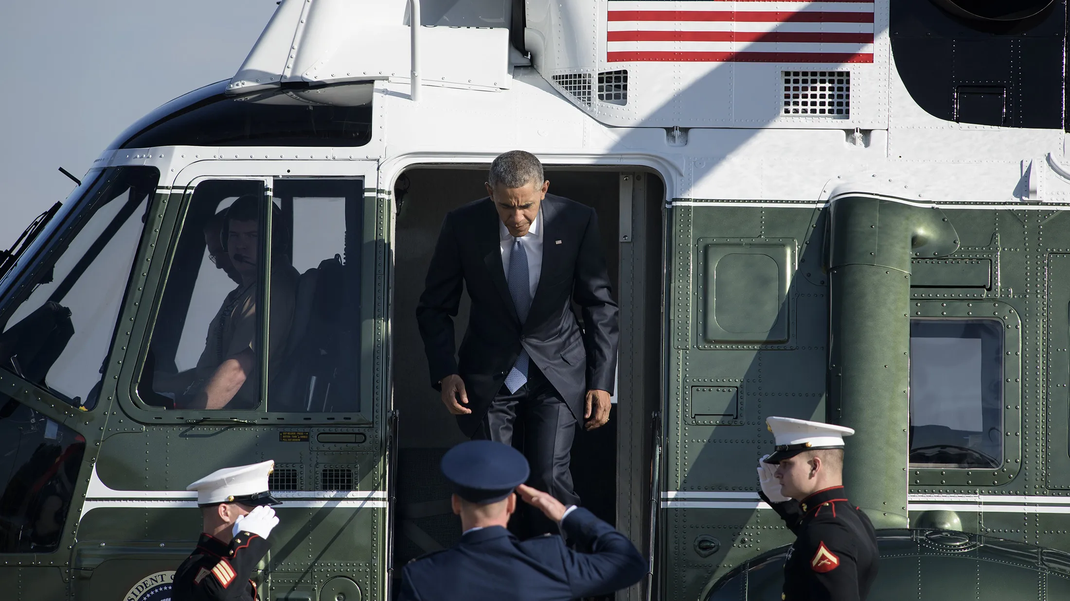 US President Barack Obama walks from Marine One to Air Force One at Andrews Air Force Base Oct. 9, in Maryland. Obama is traveling to Oregon to visit with shooting victims' loved ones before traveling to California Democratic fundraisers.
