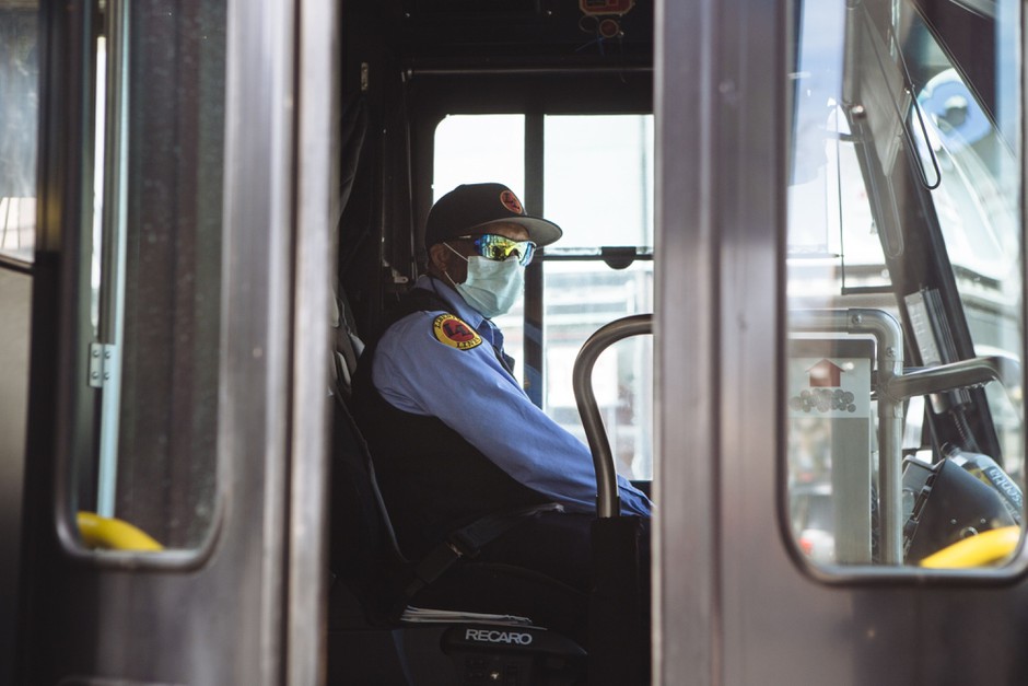 A bus driver in New Rochelle, New York, wears a protective mask. New York's MTA has been particularly hard hit with coronavirus cases.