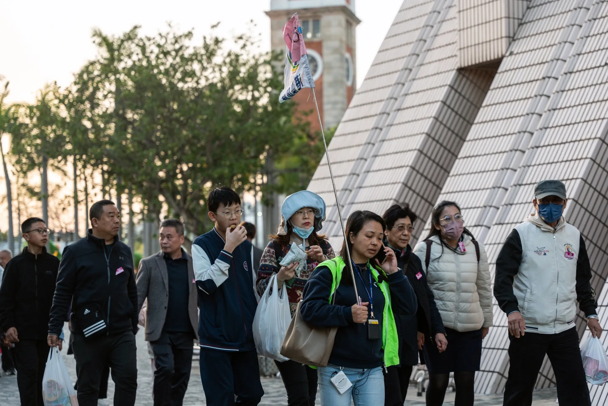 Tourists along the Tsim Sha Tsui promenade during the Lunar New Year holiday in Hong Kong on Feb. 12.