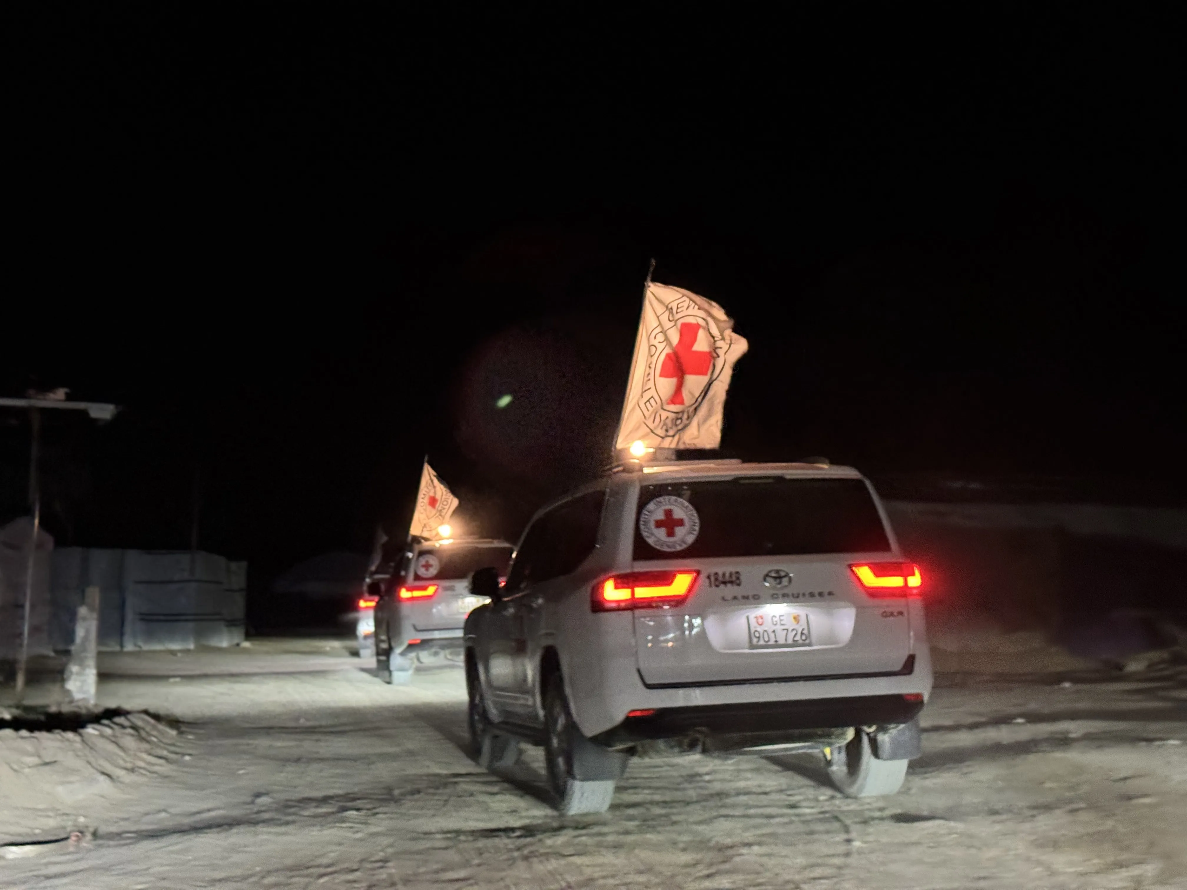 Red Cross vehicles transport bodies of Israeli hostages, in Gaza, on Feb. 27.