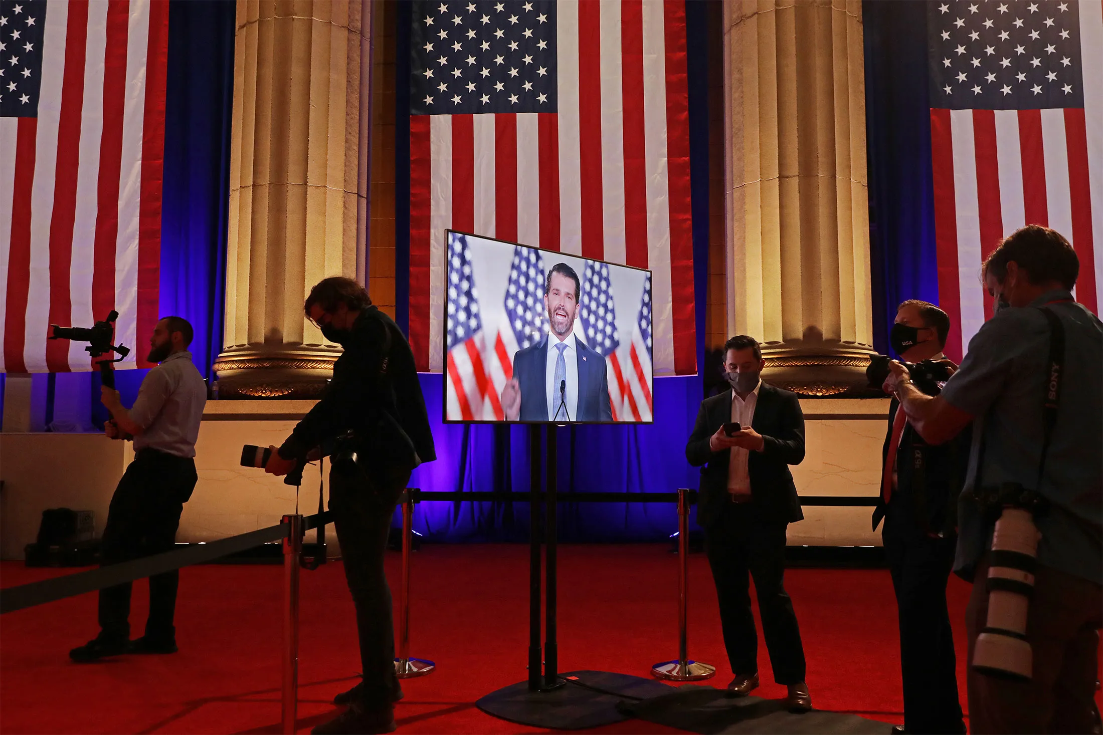 Donald Trump Jr. appears on a television screen as he pre-records his address to the Republican National Convention at the Mellon Auditorium in Washington, D.C. on&nbsp;Aug.&nbsp;24.