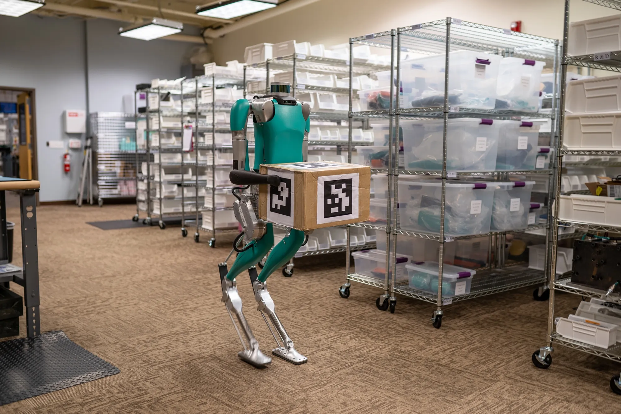 Digit, a robot designed by&nbsp;Agility Robotics, travels with delivery vehicles, unfolds, then carries packages from the curbside.