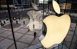 The Apple logo is seen on the window at an Apple Store in Beijing, China.