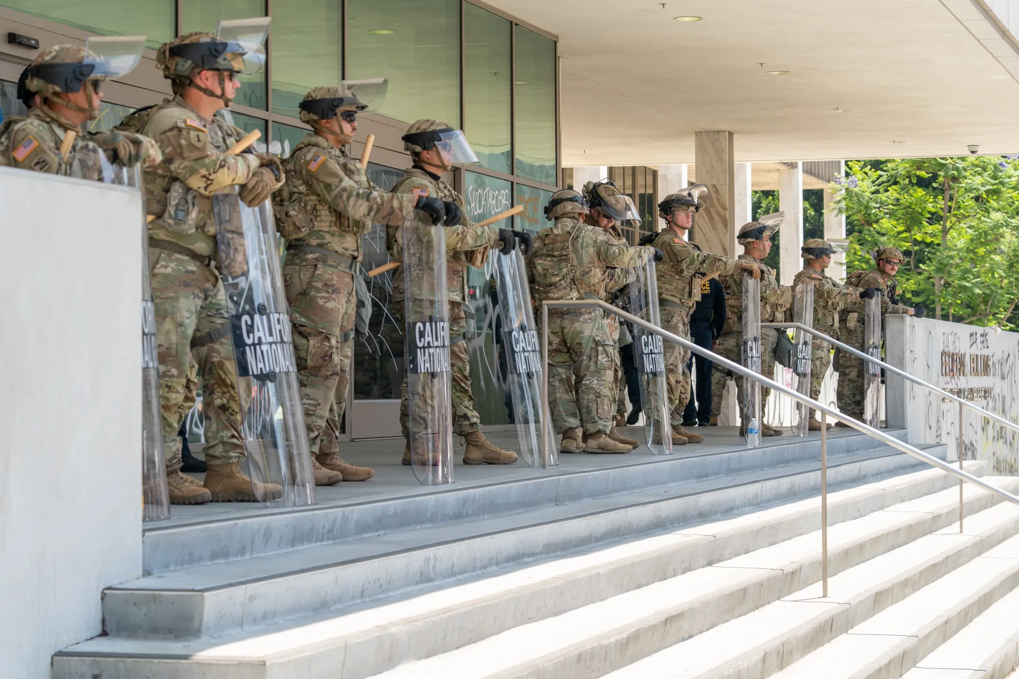 National Guard soldiers stand outside the Edward R. Roybal Federal Building in Los Angeles on Monday&nbsp;