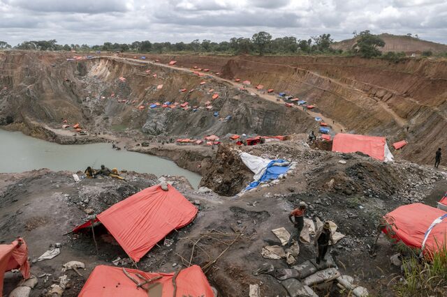 Tents cover mining shafts at an illegal site in Kisanfu.