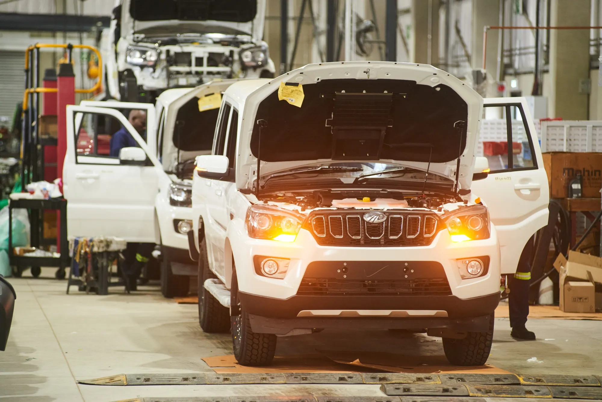 Workers assemble Mahindra &amp; Mahindra Ltd. 4x4 pickup vehicles in Durban, South Africa.