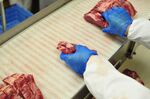 Rib-eye beef steak on a packaging line.