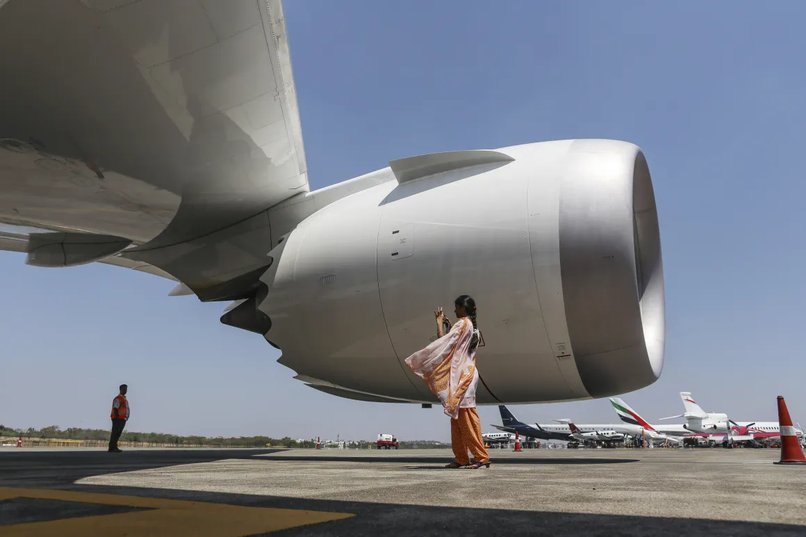 A visitor takes a photograph of a Boeing Co. 787 Dreamliner aircraft&nbsp;in Hyderabad, India.
