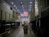 An American flag hangs as General Electric Co. (GE) Evolution Series Tier 4 diesel locomotives stand on the final assembly line at the GE Manufacturing Solutions facility in Fort Worth, Texas, U.S., on Tuesday, Oct. 25, 2016. The U.S. Census Bureau is scheduled to release durable goods figures on October 27.