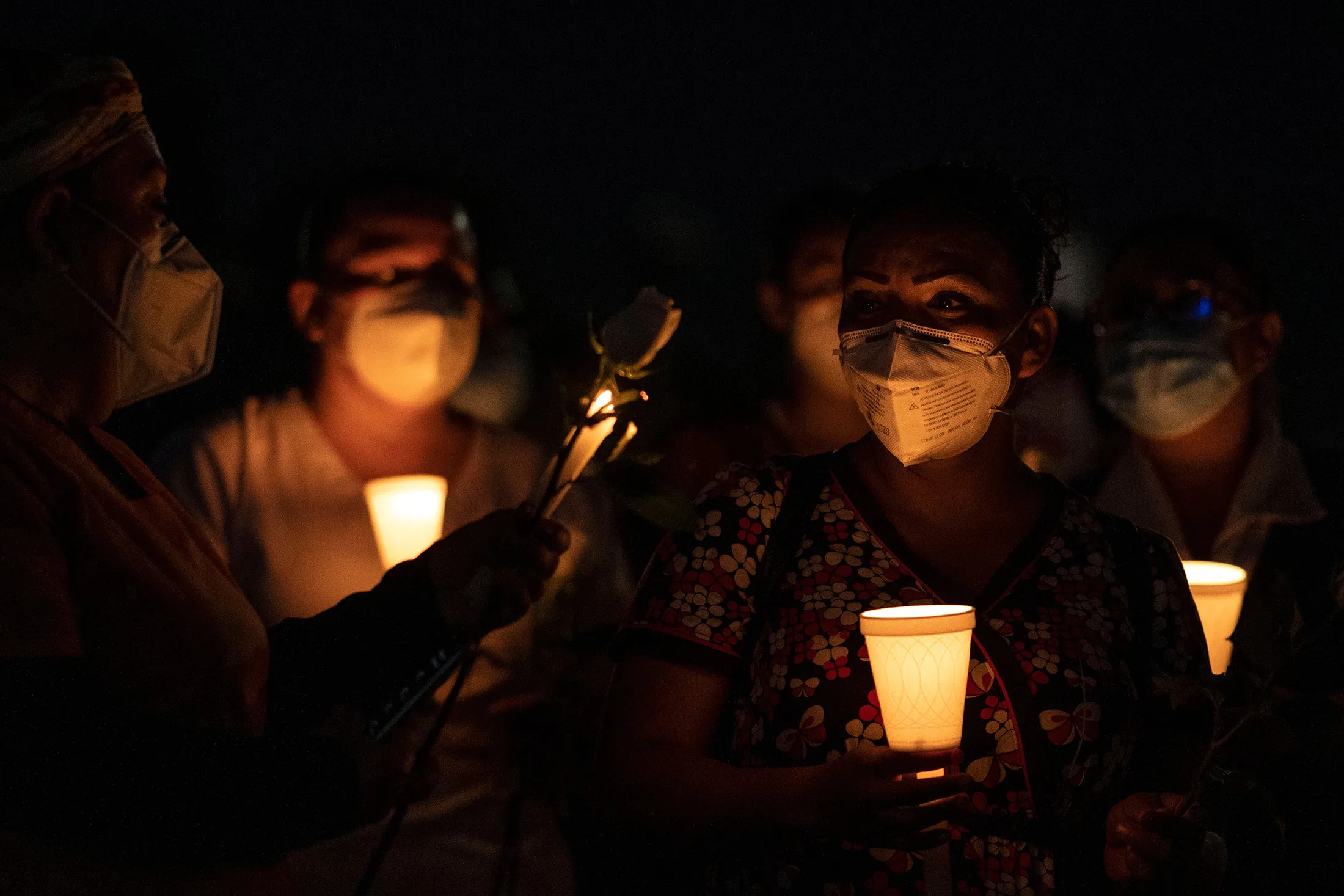 Health workers hold candles during a vigil to honor a nurse who died of Covid-19 at IMSS Hospital Regional #1 in Tijuana, Baja California, Mexico&nbsp;on June 2.
